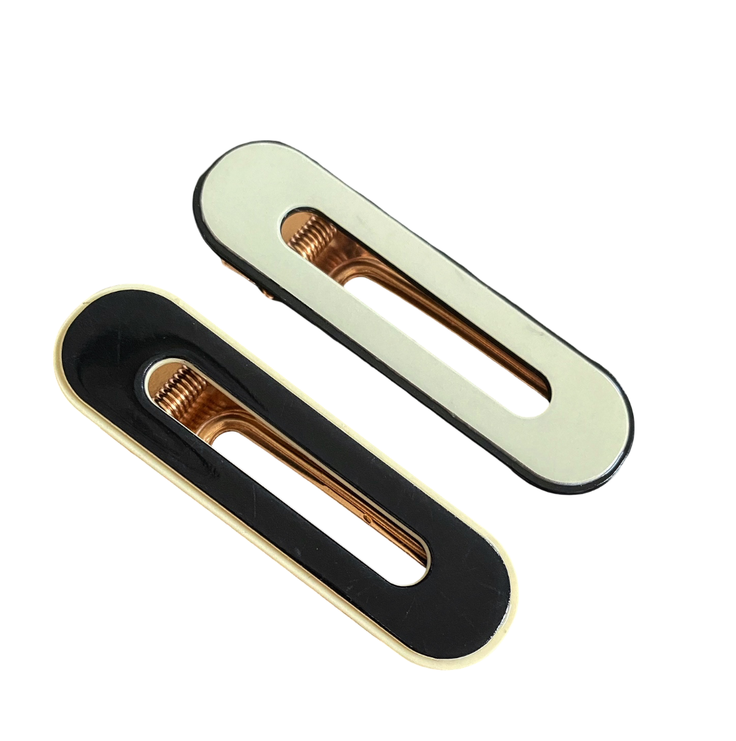 Sylvie Oval Cut Out Hair Clip in mint green and black, holding fine to medium hair