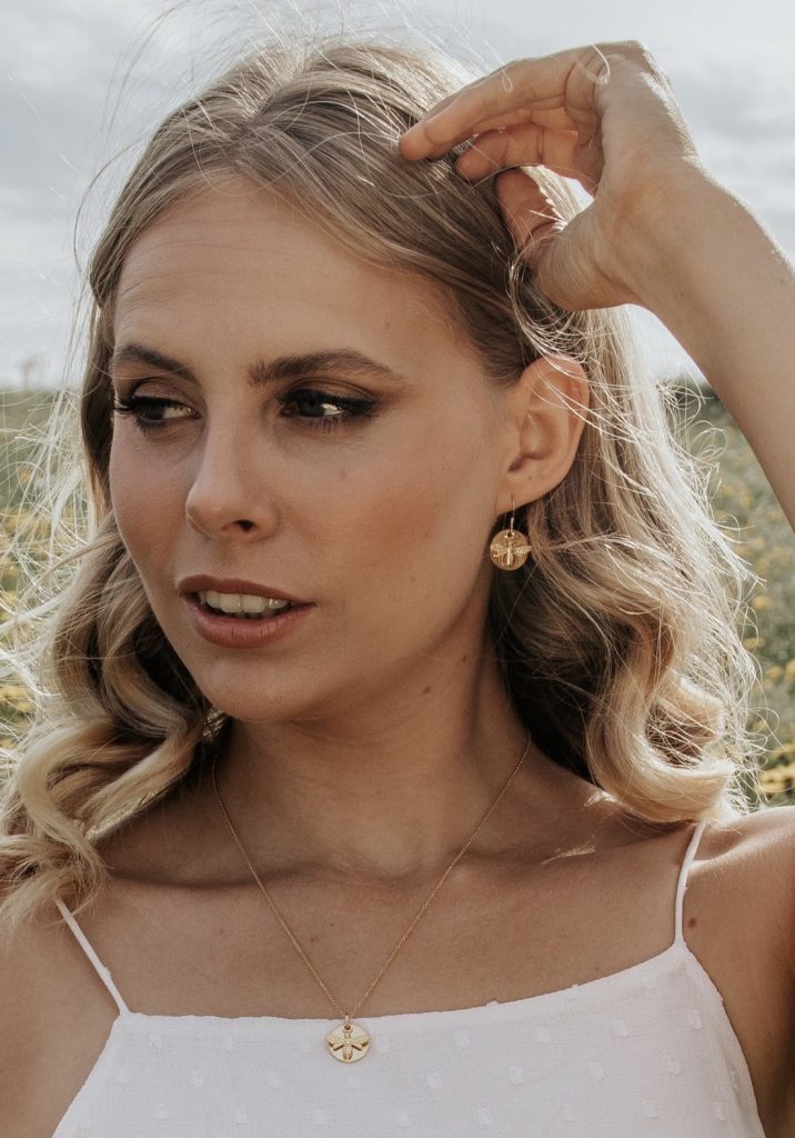 Model wears Wisteria London Gold Bee Coin Earrings
