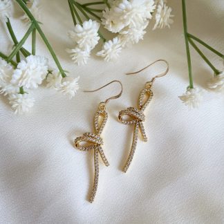 Mirabelle CZ bow earrings, sparkling cubic zirconia statement earrings with dainty bow design, perfect for parties, weddings and festive occasions.